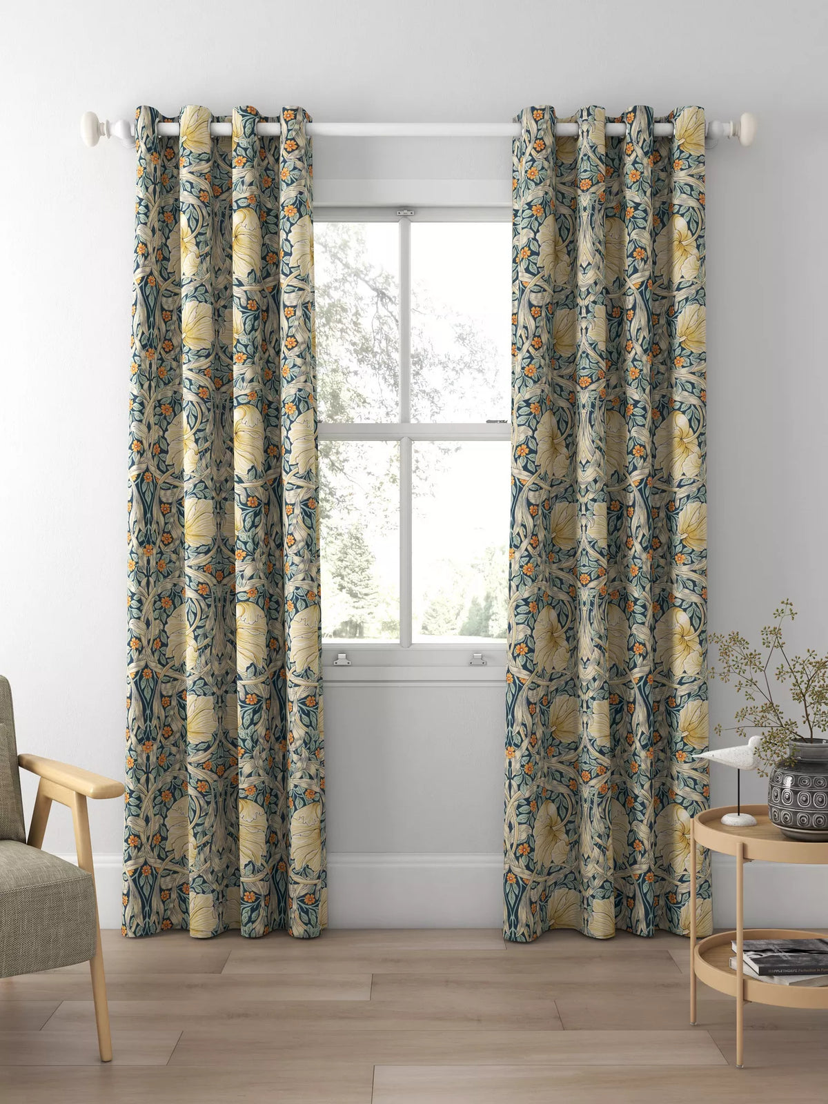 a window with curtains and a chair