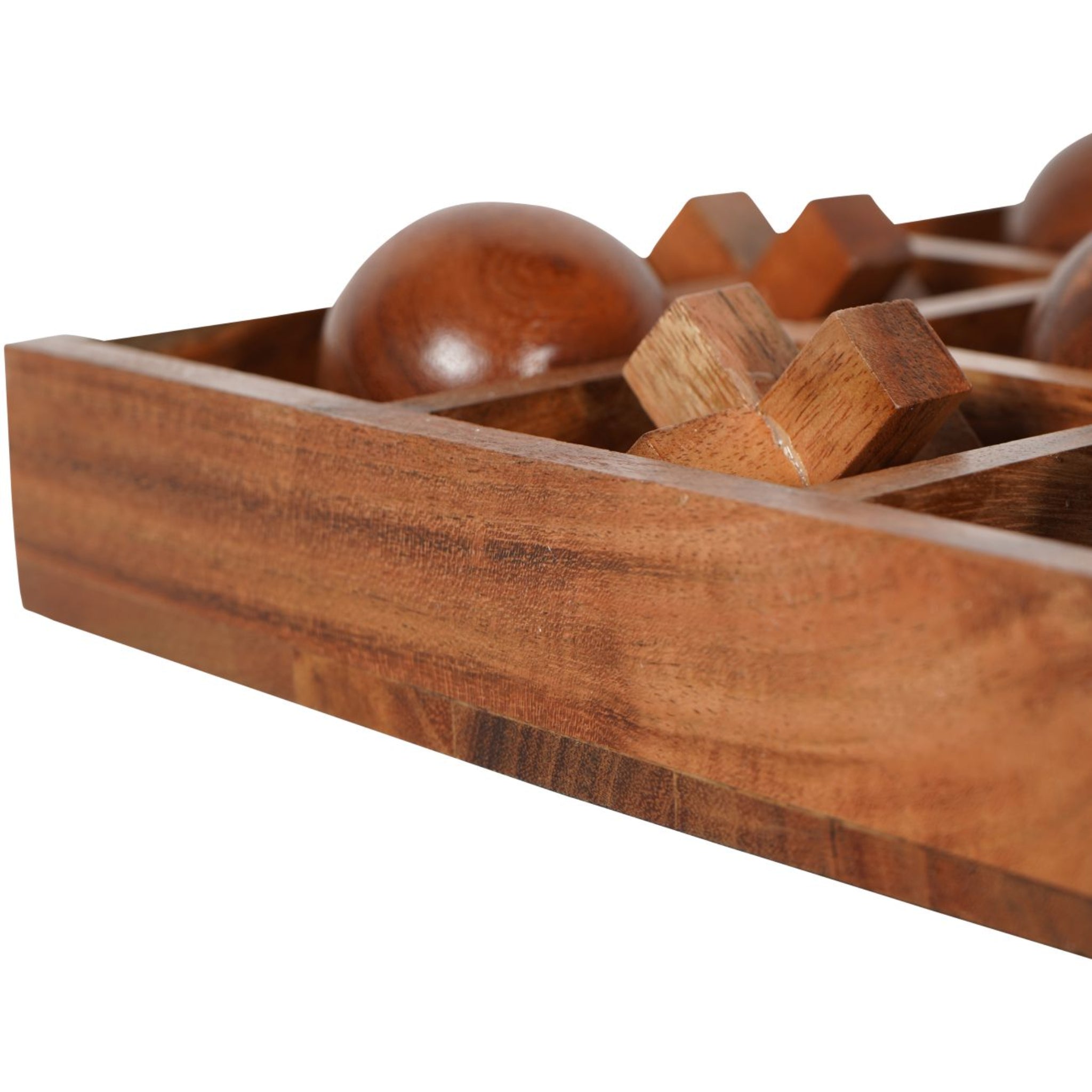 Wooden puzzle with various wooden pieces in a box on a white background