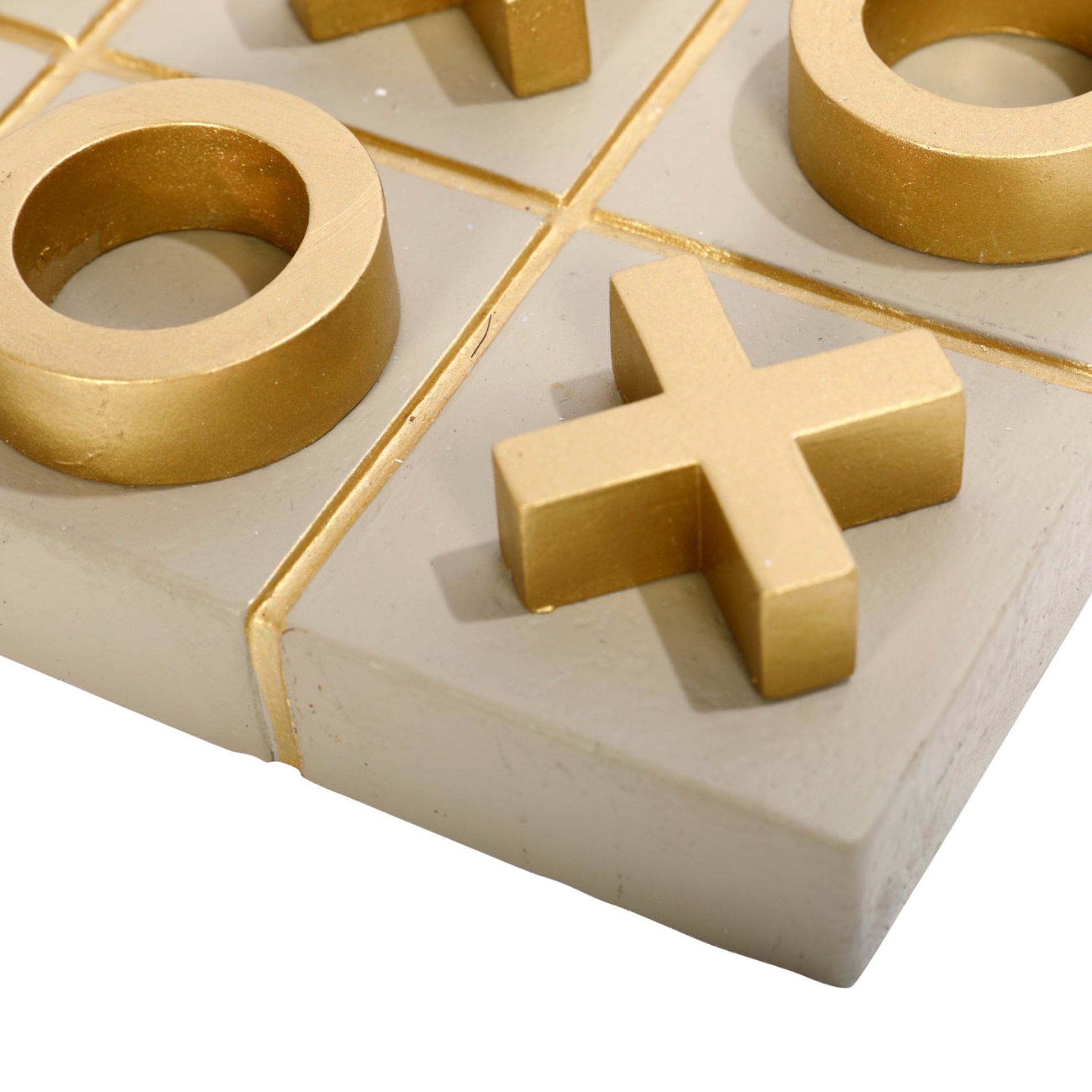 Close-up of a tic-tac-toe board with gold &