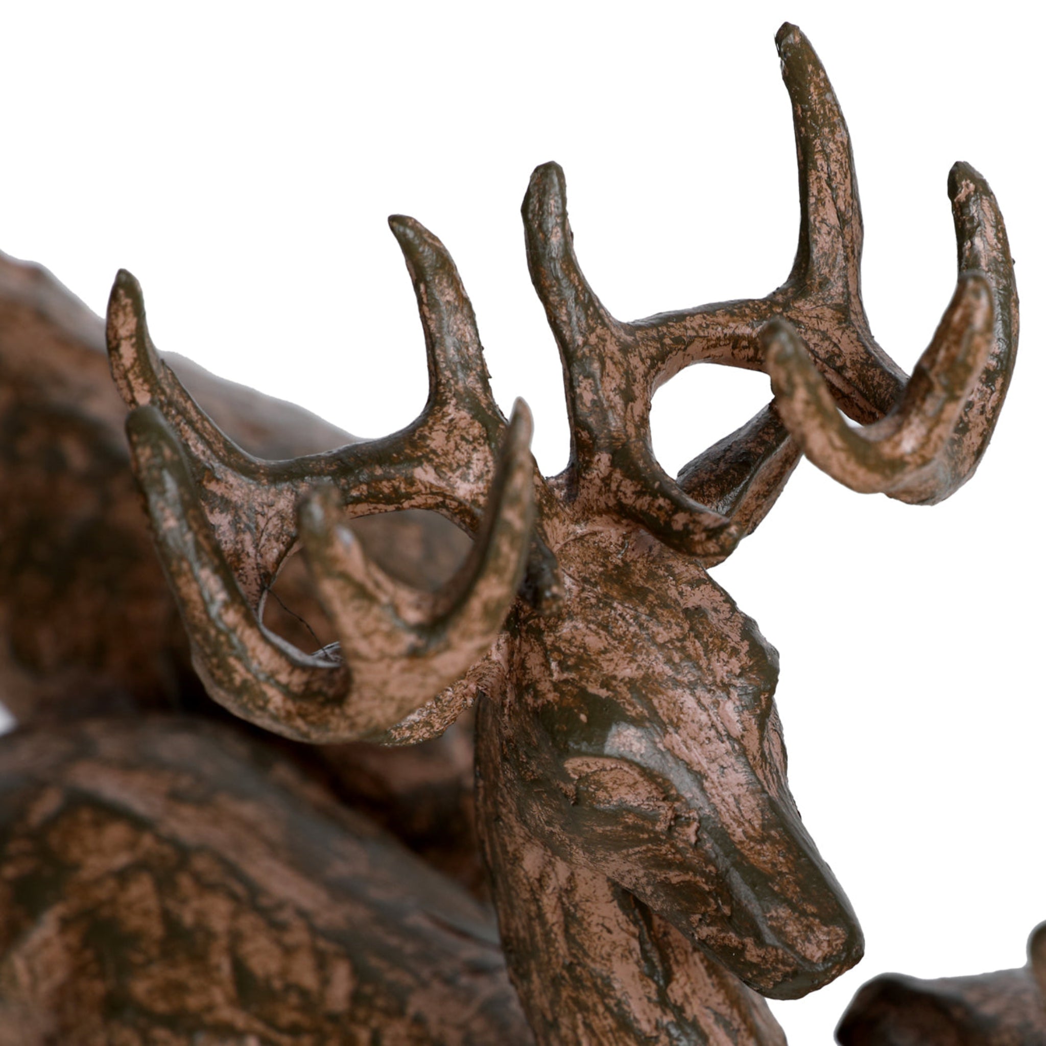 Bronze deer statue with detailed antlers on a white background