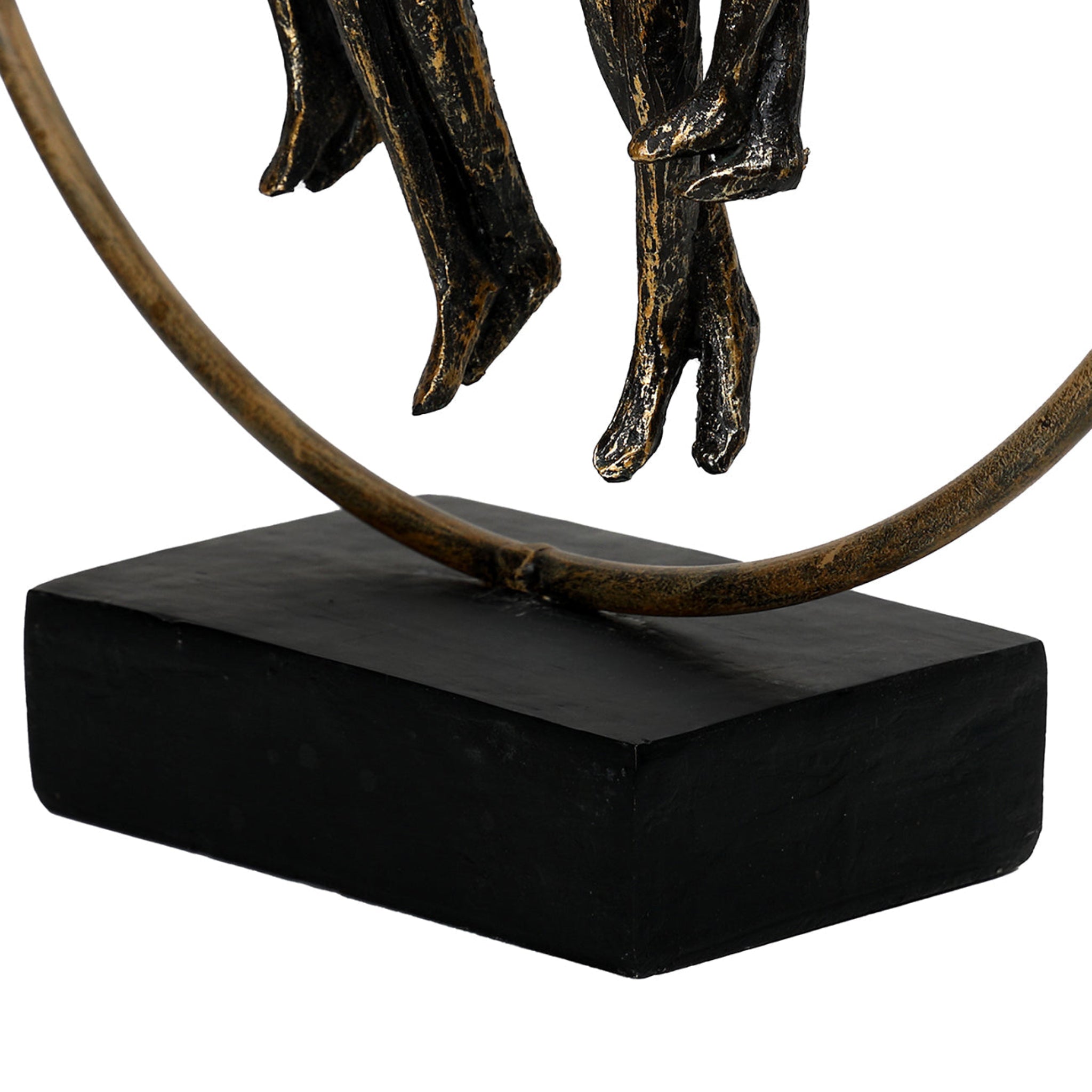 Bronze sculpture of a figure on a black base against a white background