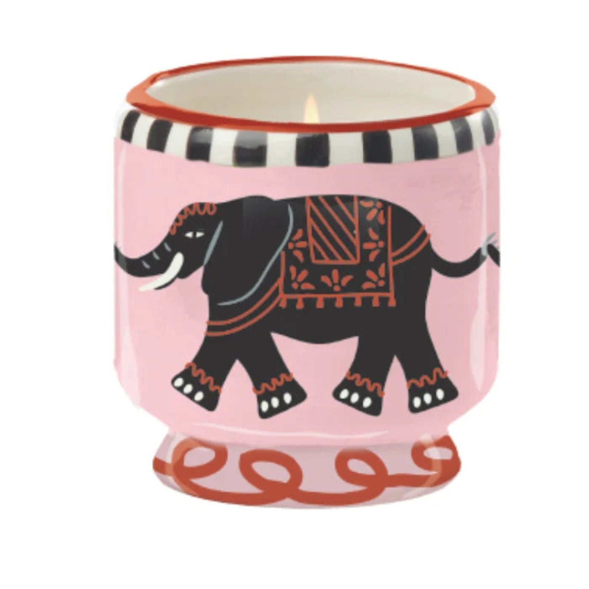 Candle in a pink holder with an elephant design on a white background