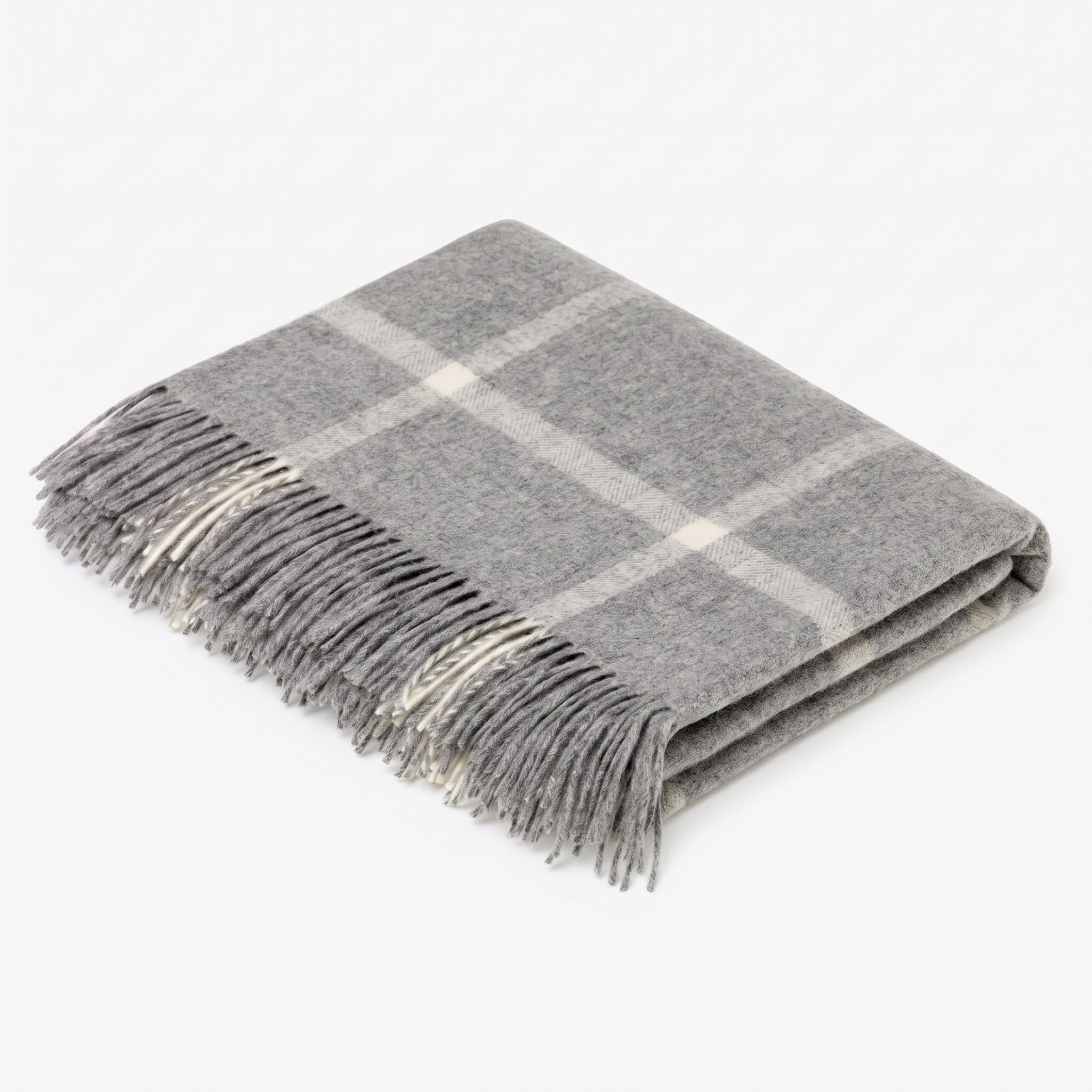 A folded gray plaid throw blanket with fringed edges, displayed on a clean white background.