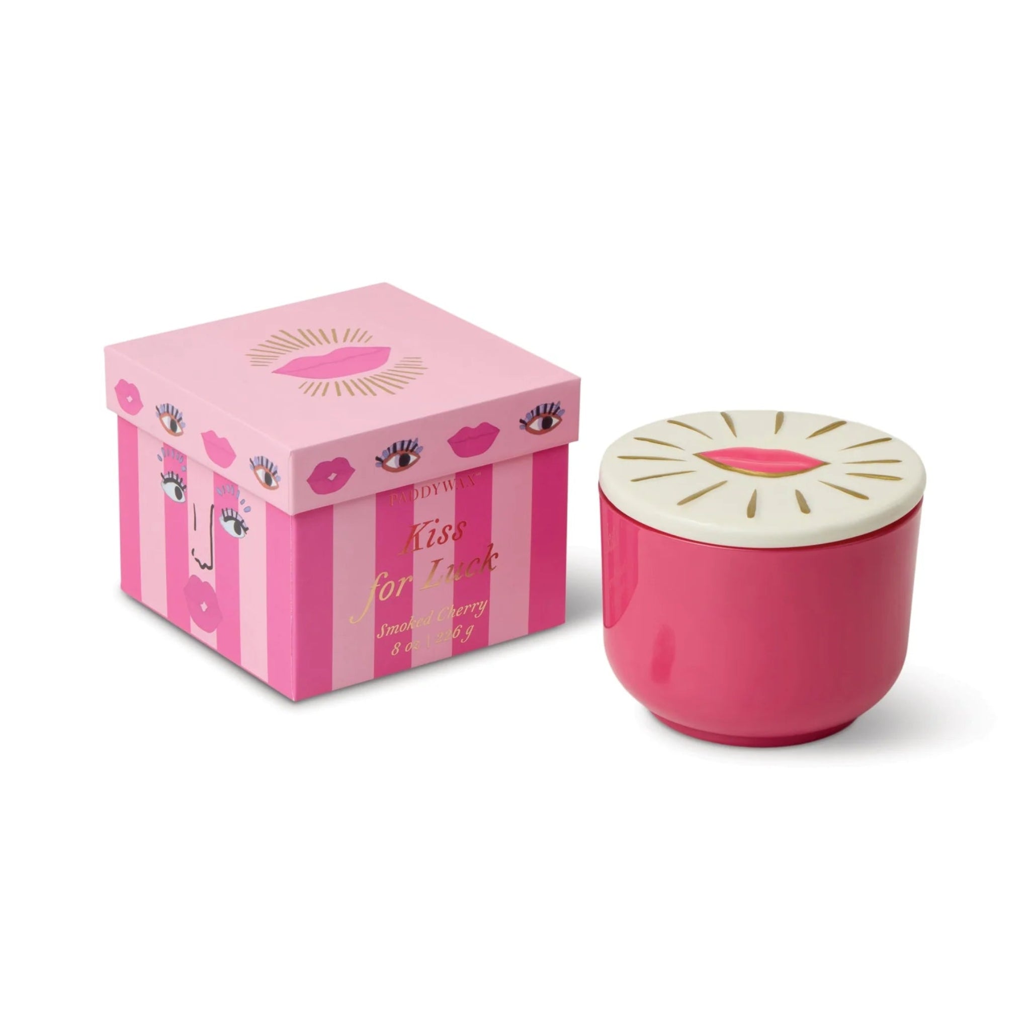 Pink candle with white lid and matching pink box on a white background