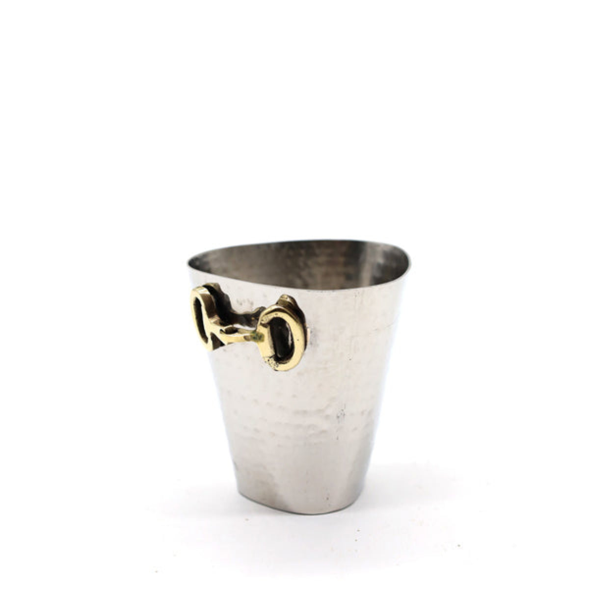 A small hammered silver metal cup with a gold horsebit handle, photographed on a clean white background.
