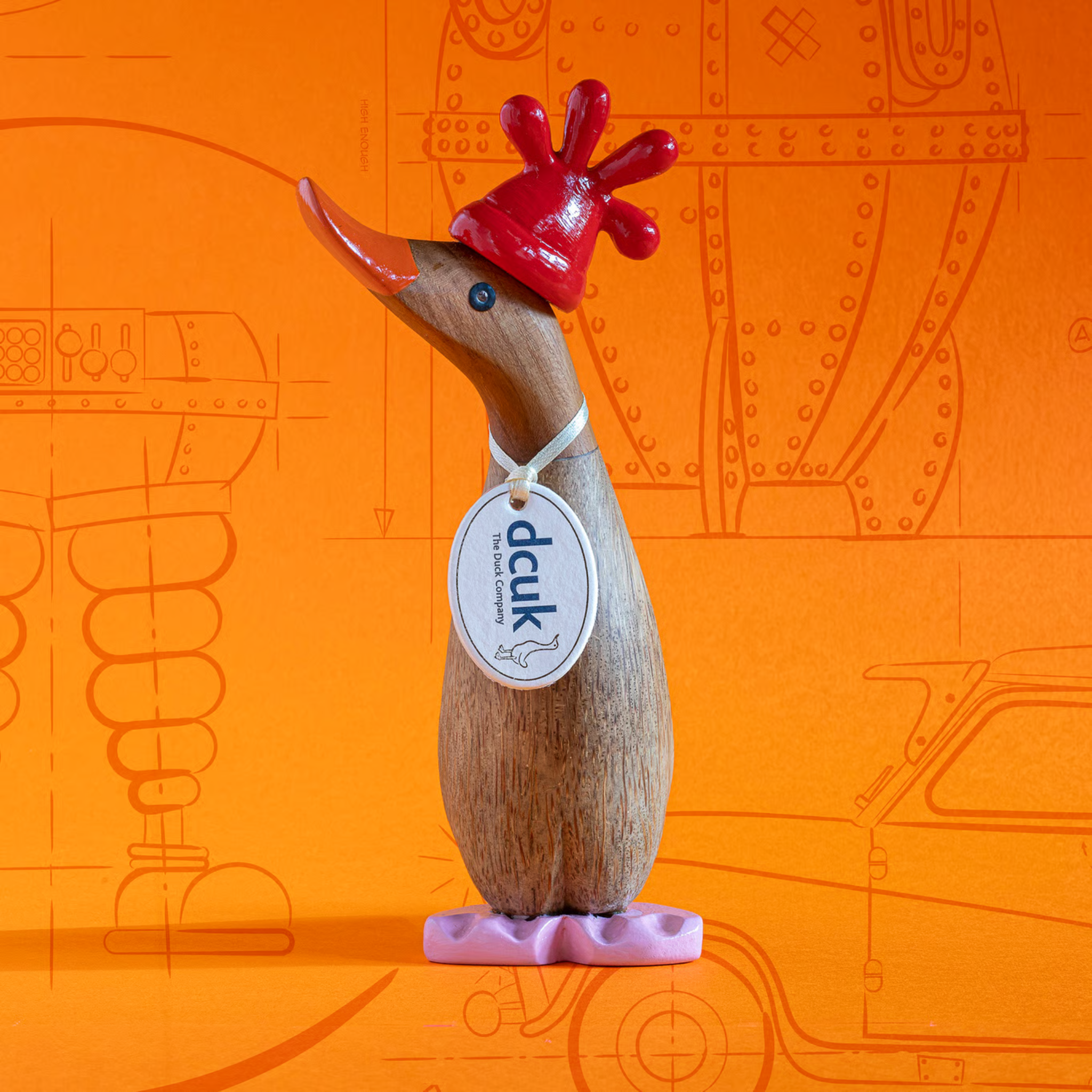 Wooden duck figurine with a red hat on an orange background with line drawings