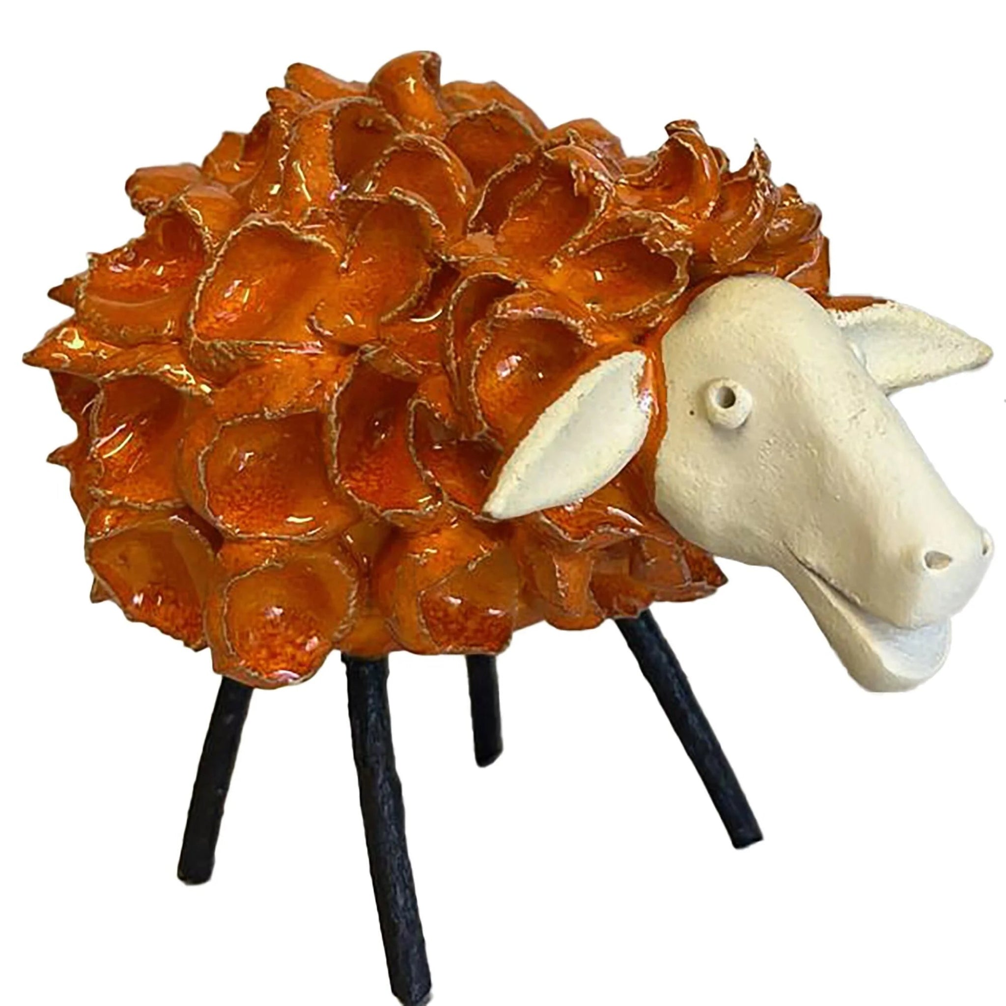 Decorative sheep sculpture with orange fleece on a white background