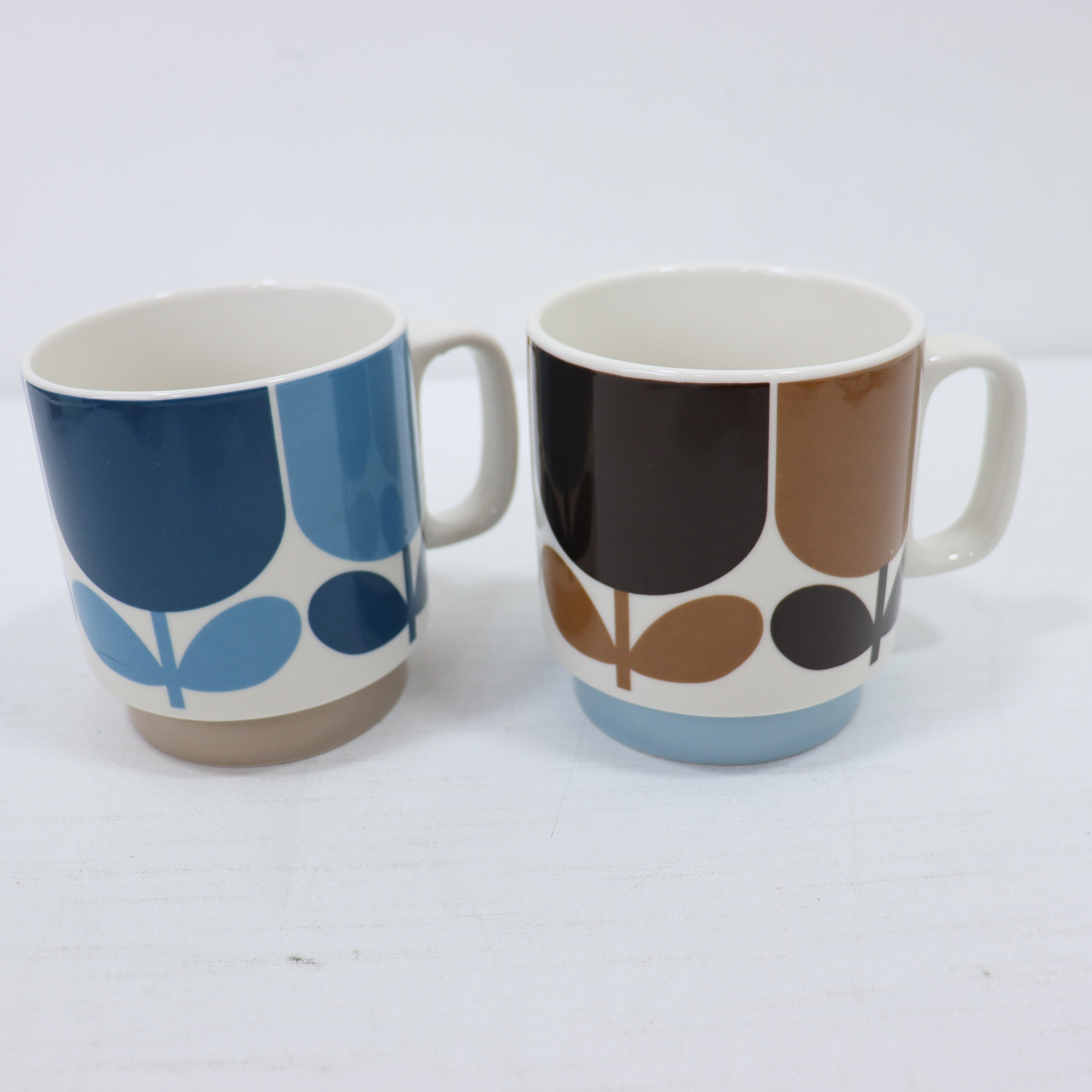 two cups on a white surface