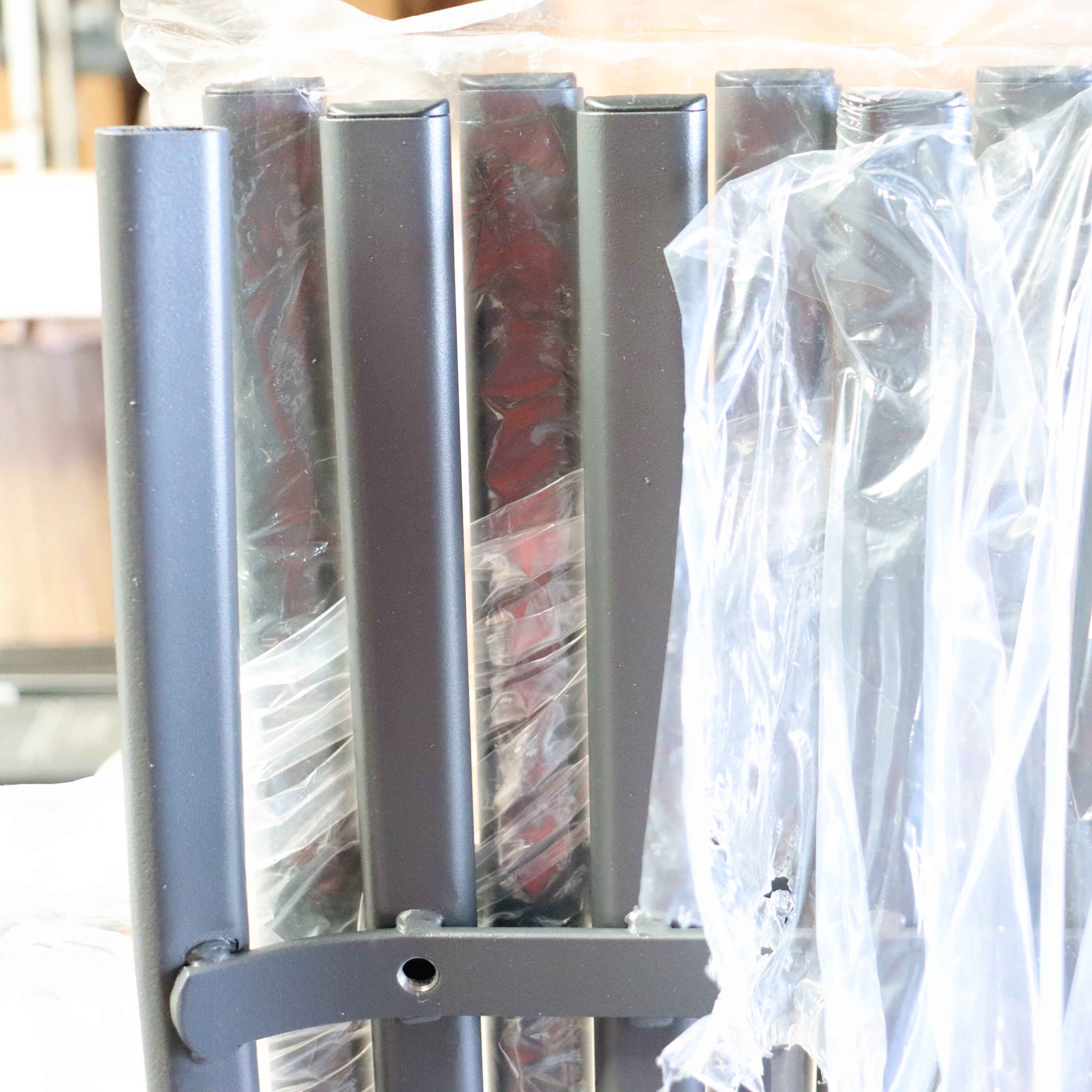 a metal bar with plastic wrap around it