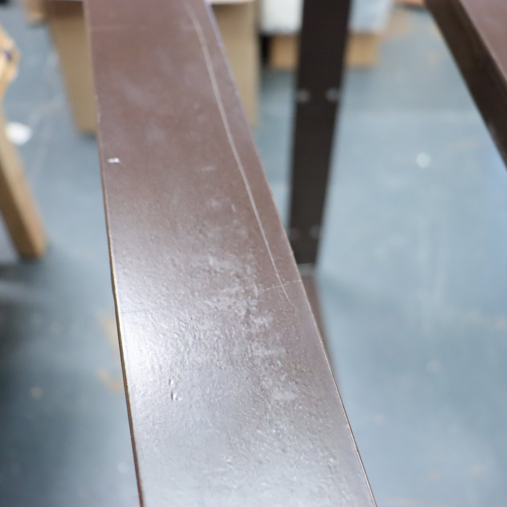 Nkuku Oso Rustic Wooden Dining Table legs with scratch on