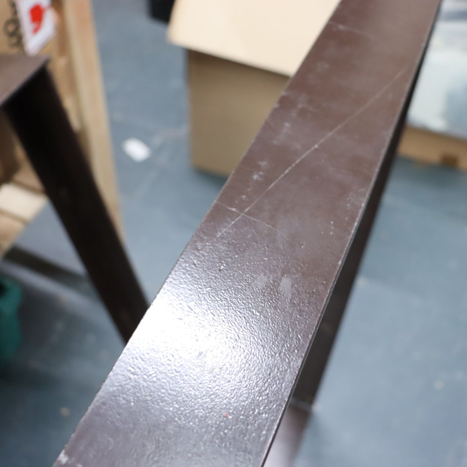 Nkuku Oso Rustic Wooden Dining Table  legs with scratch on