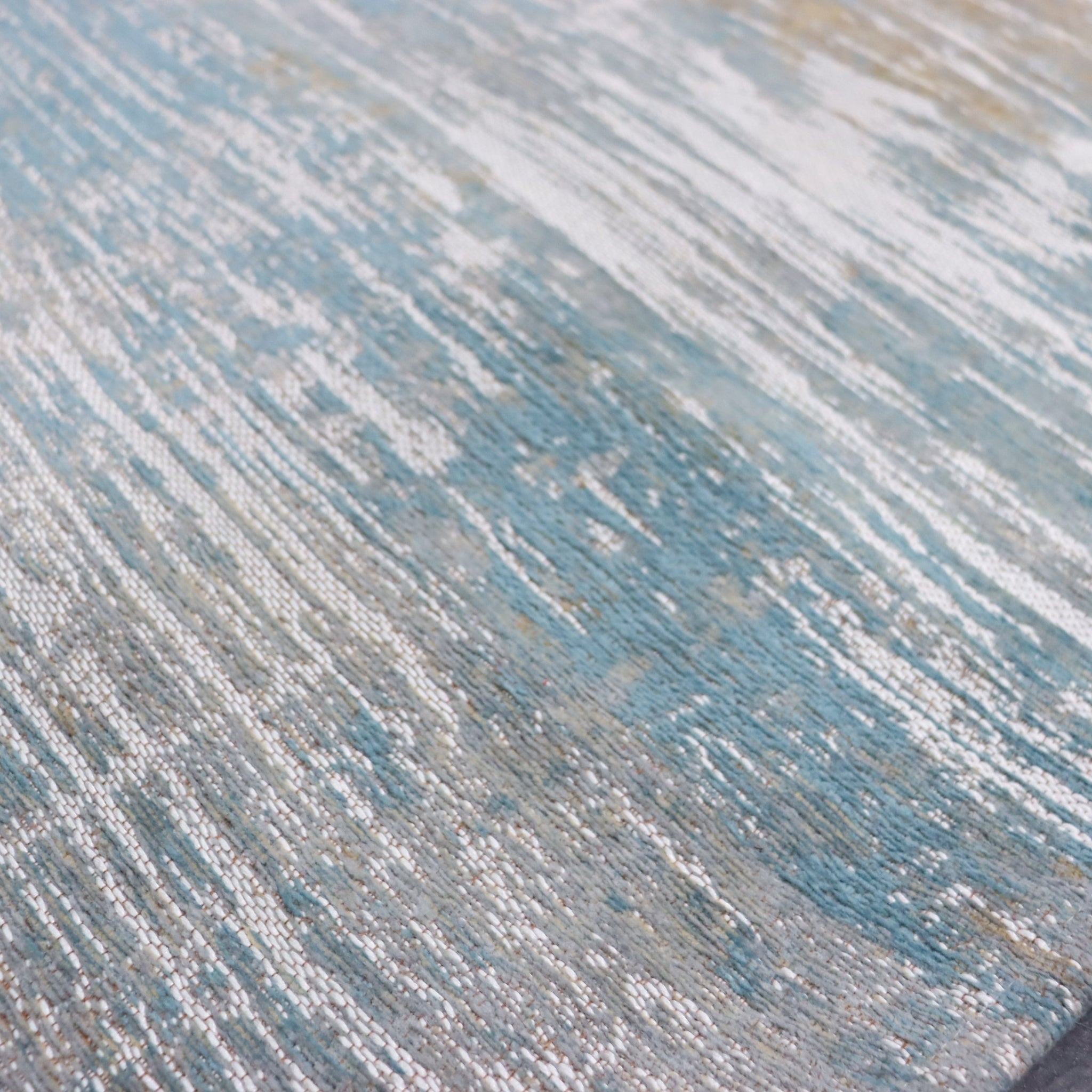 Close-up of a textured blue and gray rug