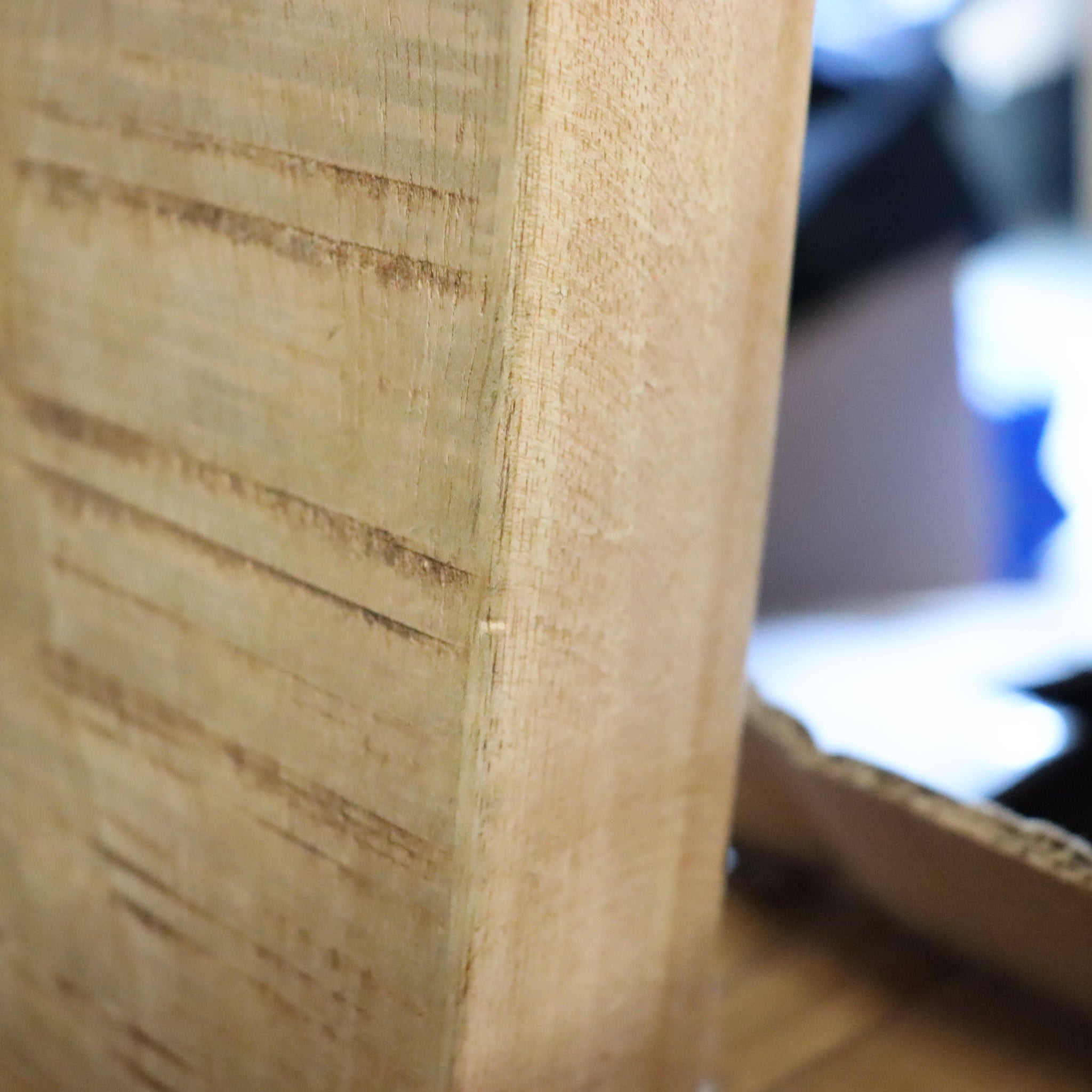 Close-up of a wooden surface with a blurred background