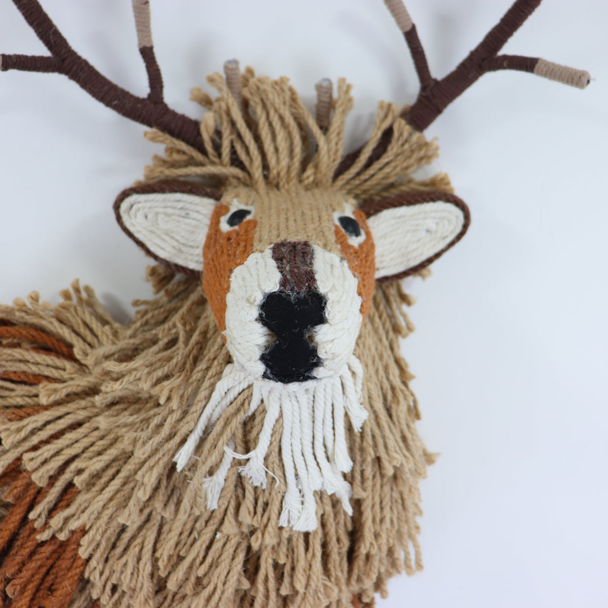 a stuffed animal with a white face