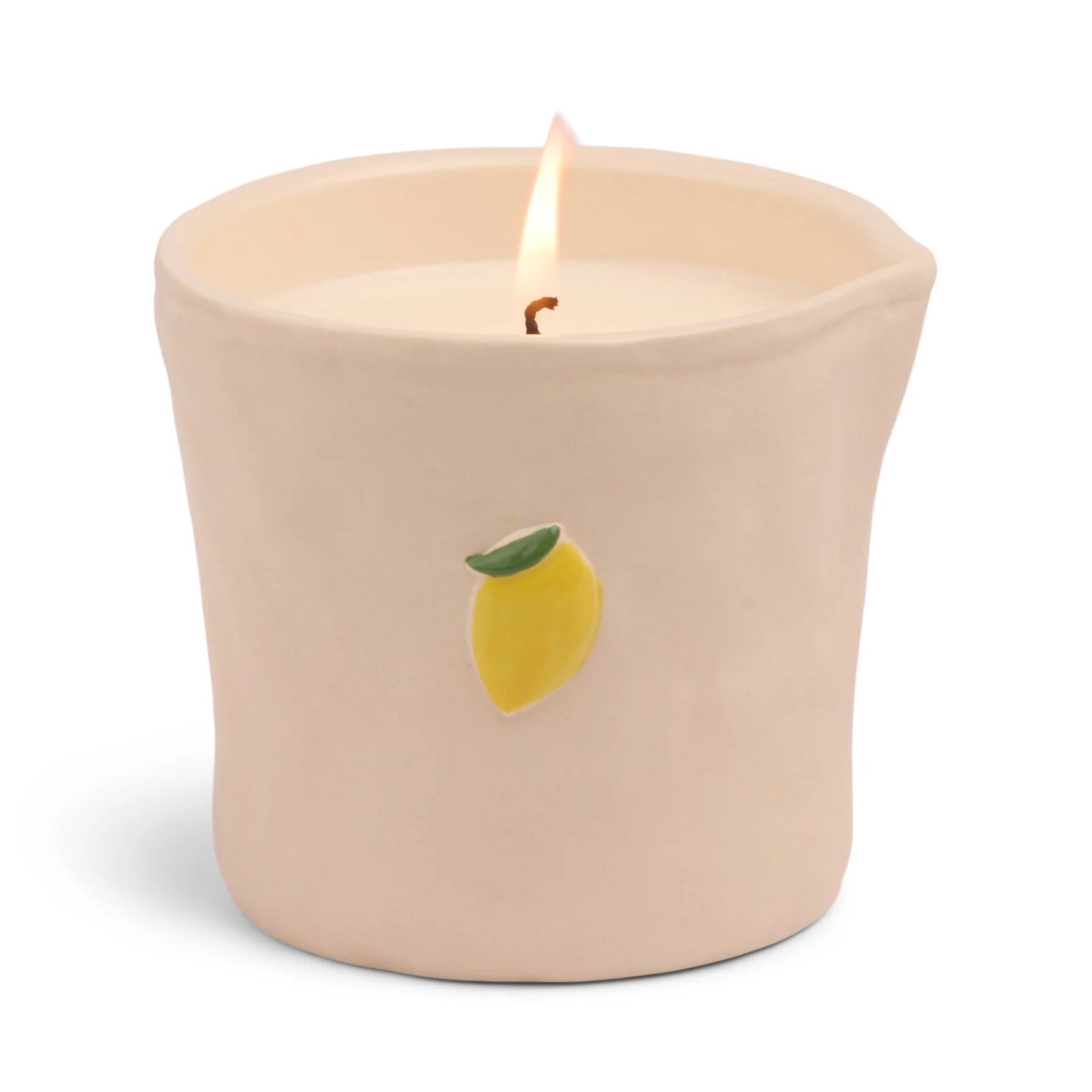 Beige candle with a lemon design on a white background