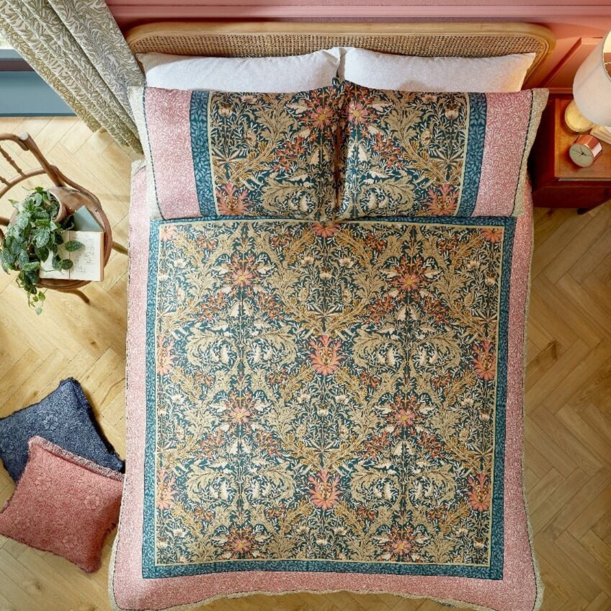 Decorative pillow with intricate pattern on a bed in a bedroom setting