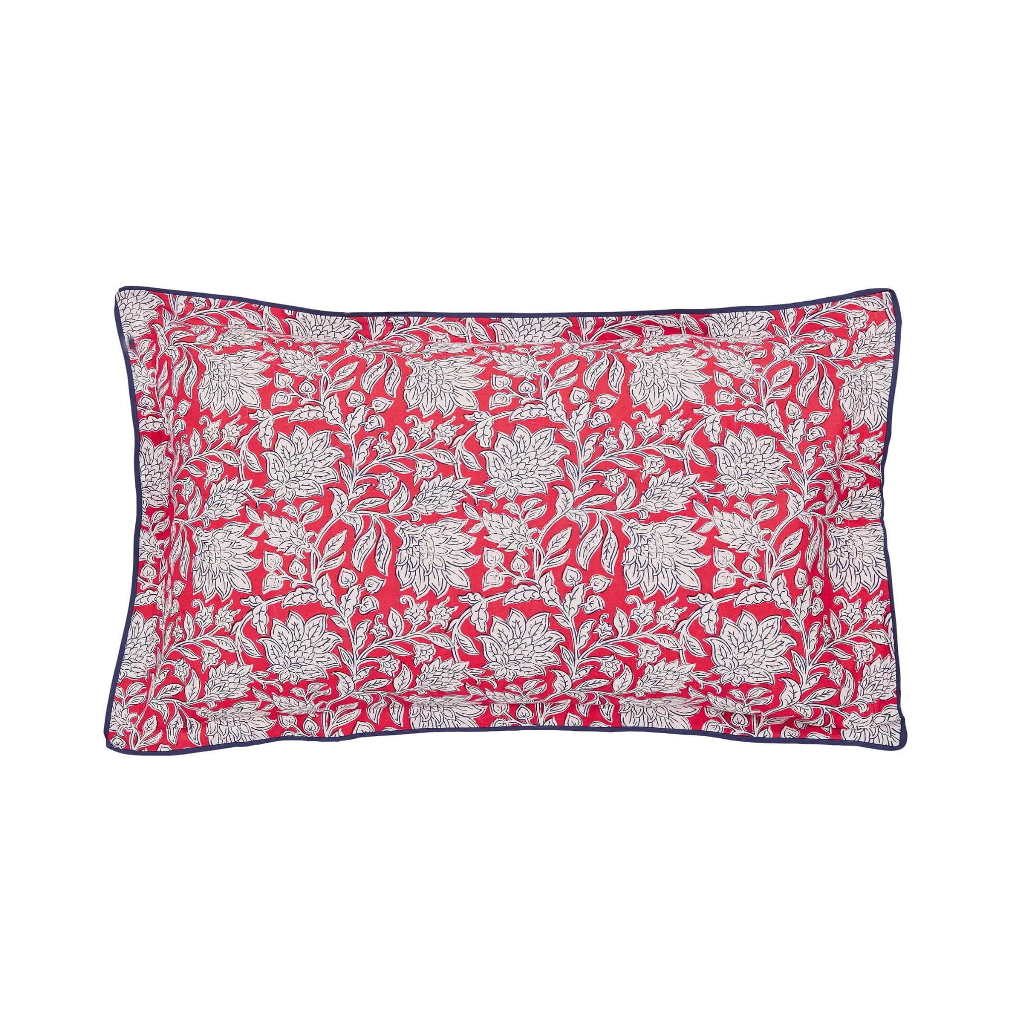 Floral patterned pillow with red and white design on a white background