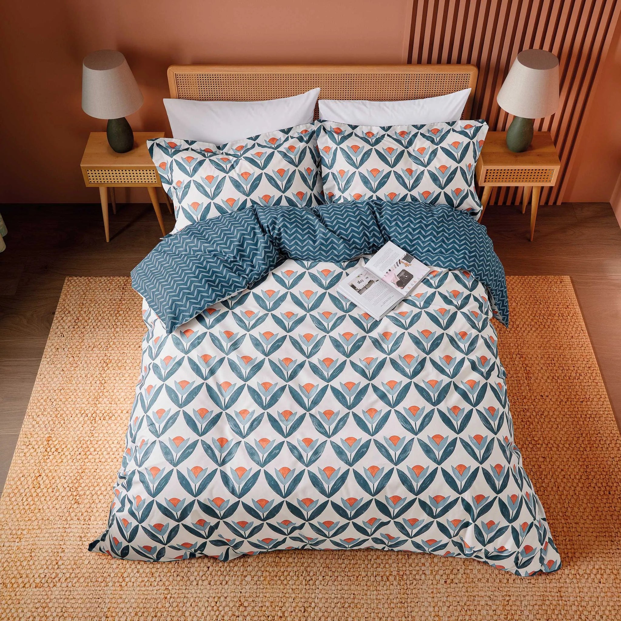 Bed with floral patterned bedding in a bedroom setting