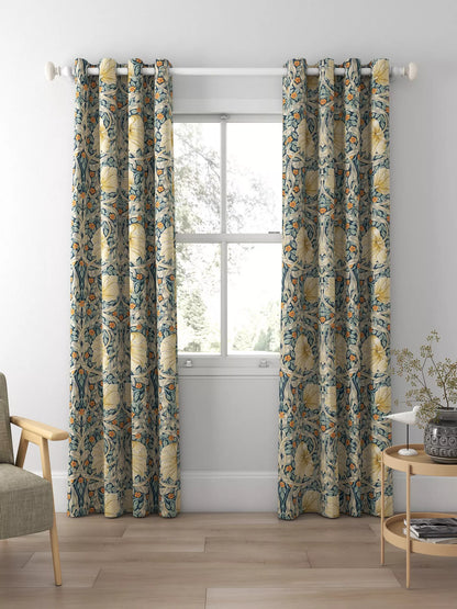 a window with curtains and a chair
