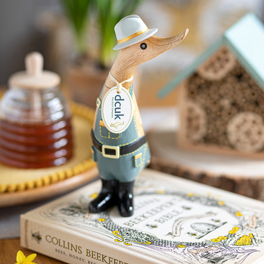 a duck figurine on a book