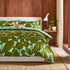 a bed with a green and blue comforter