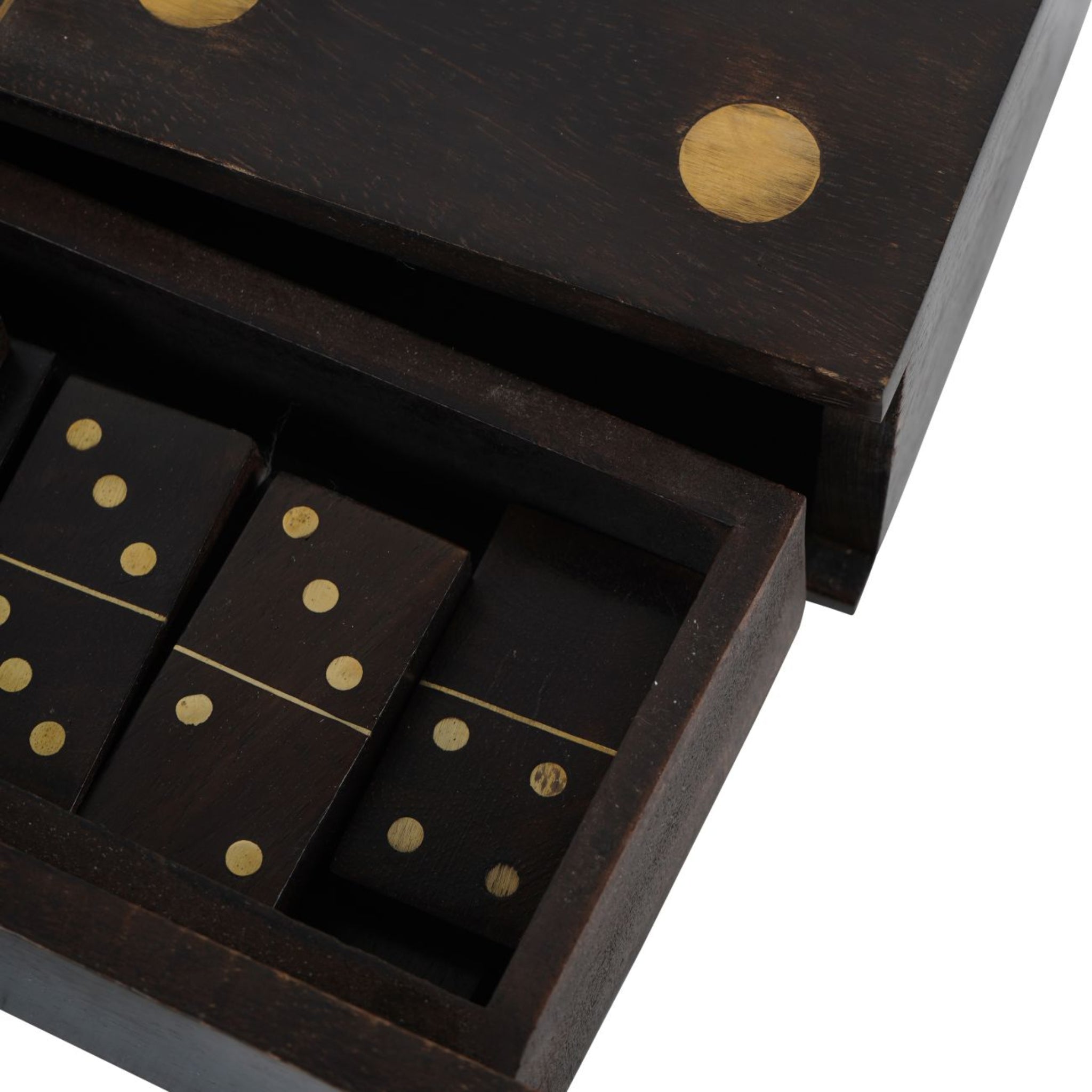 Black dominoes set with gold dots in a wooden box on a white background