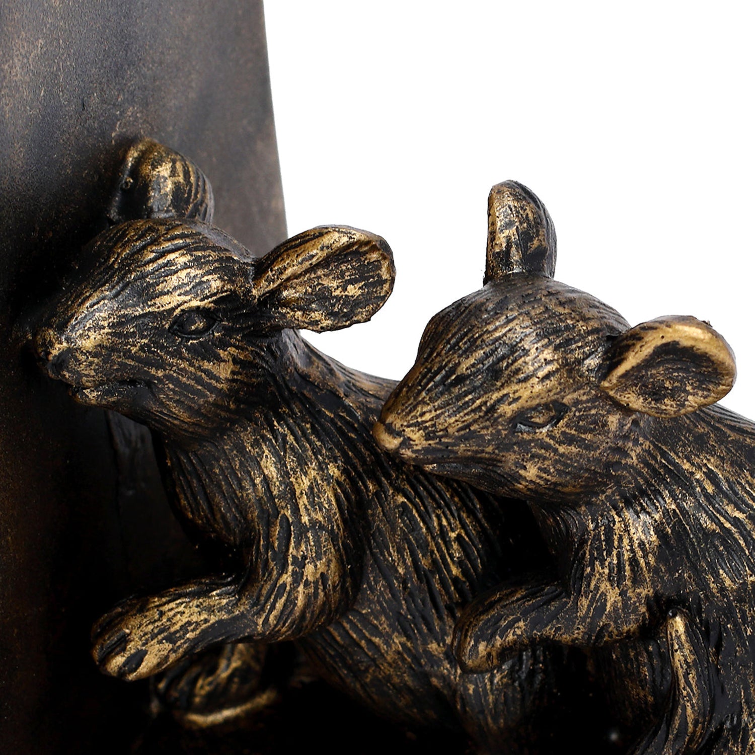 Bronze sculpture of two rats on a dark background