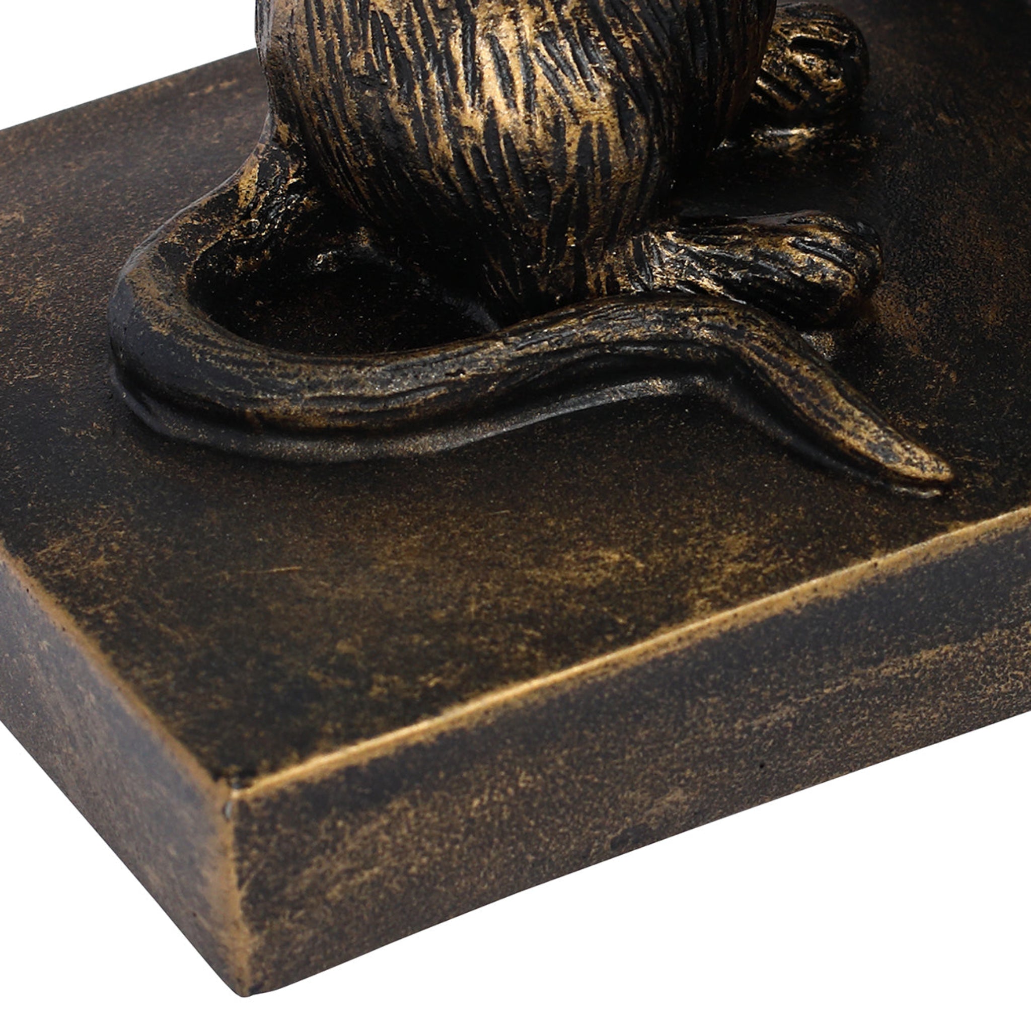 Bronze sculpture of a cat on a rectangular base