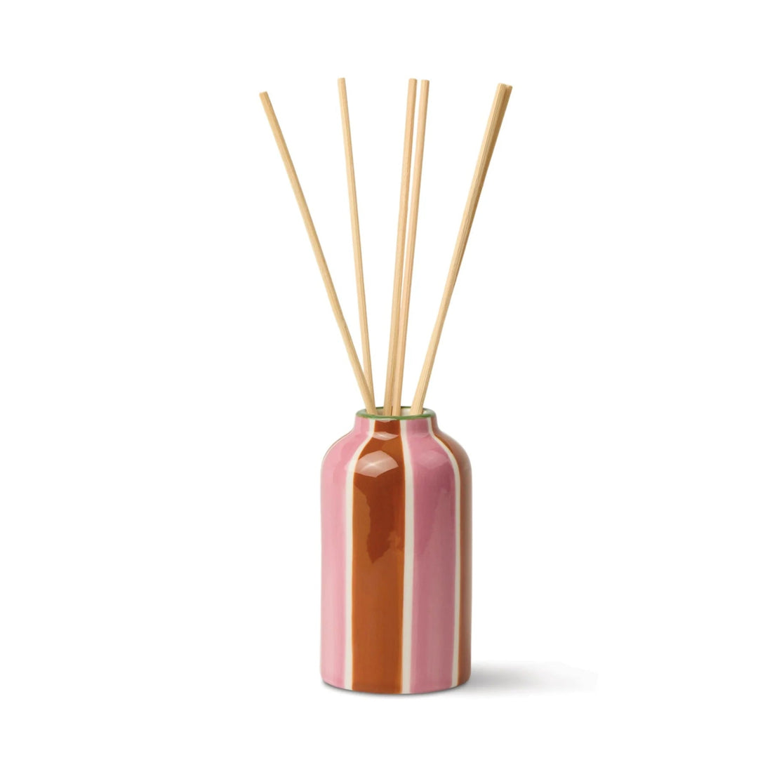 Pink and brown diffuser with wooden sticks on a white background