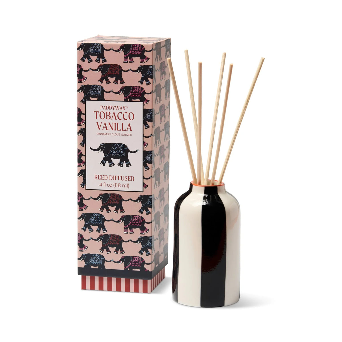 a black and white striped vase with sticks in it next to a box