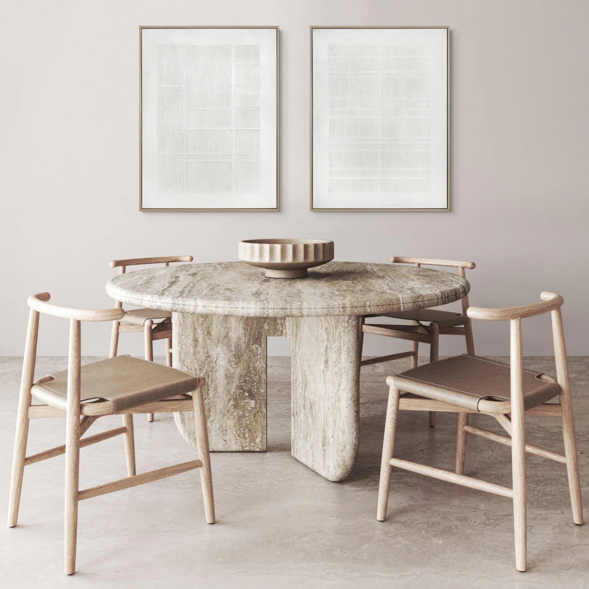 Dining room with marble table and wooden chairs against a light gray wall.