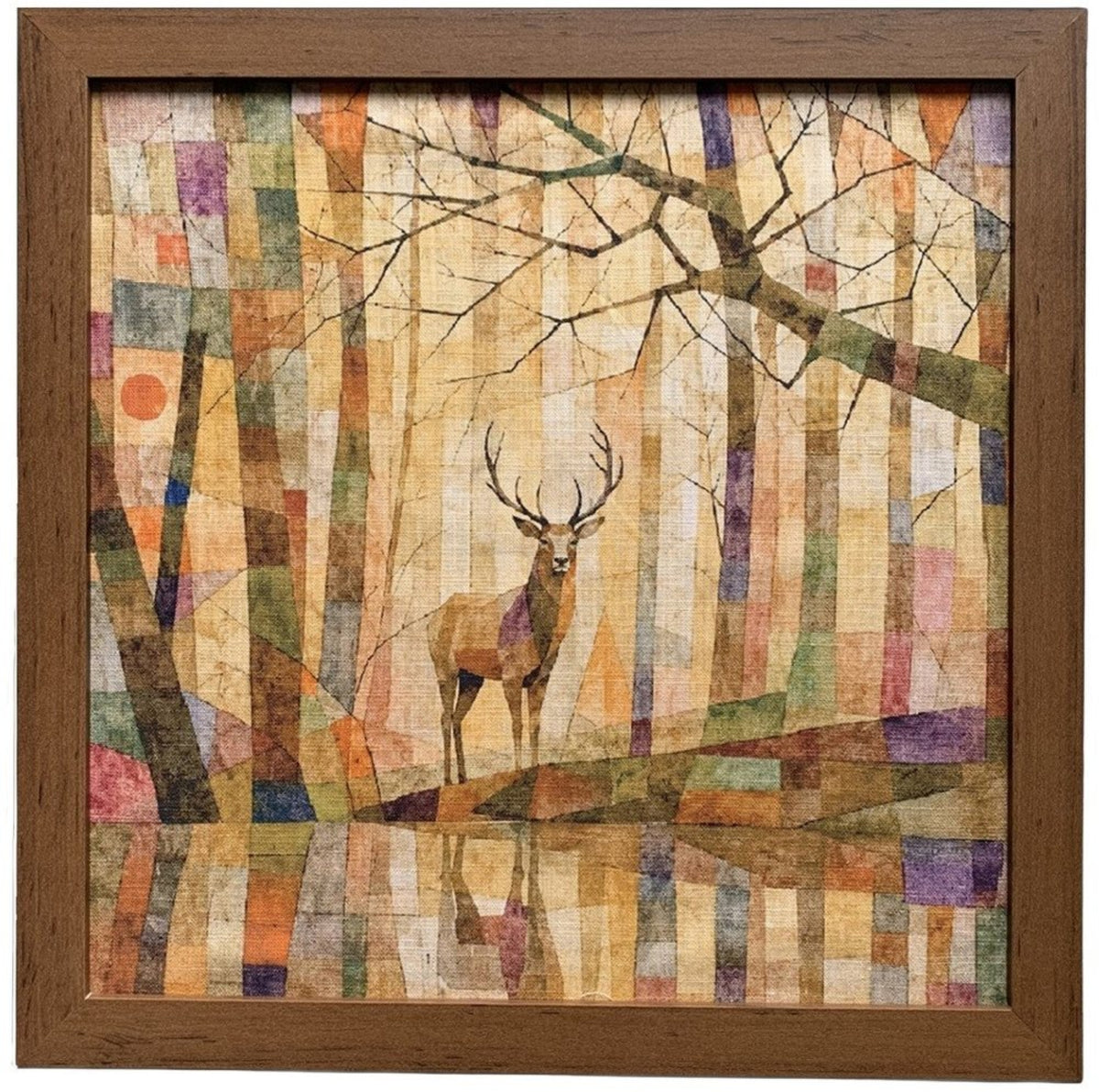 Framed square wall art featuring a stylized deer standing in a patchwork forest scene with trees, branches, and reflective water, surrounded by a medium brown wooden frame.