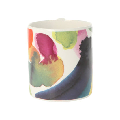Colorful ceramic mug with abstract design on a white background