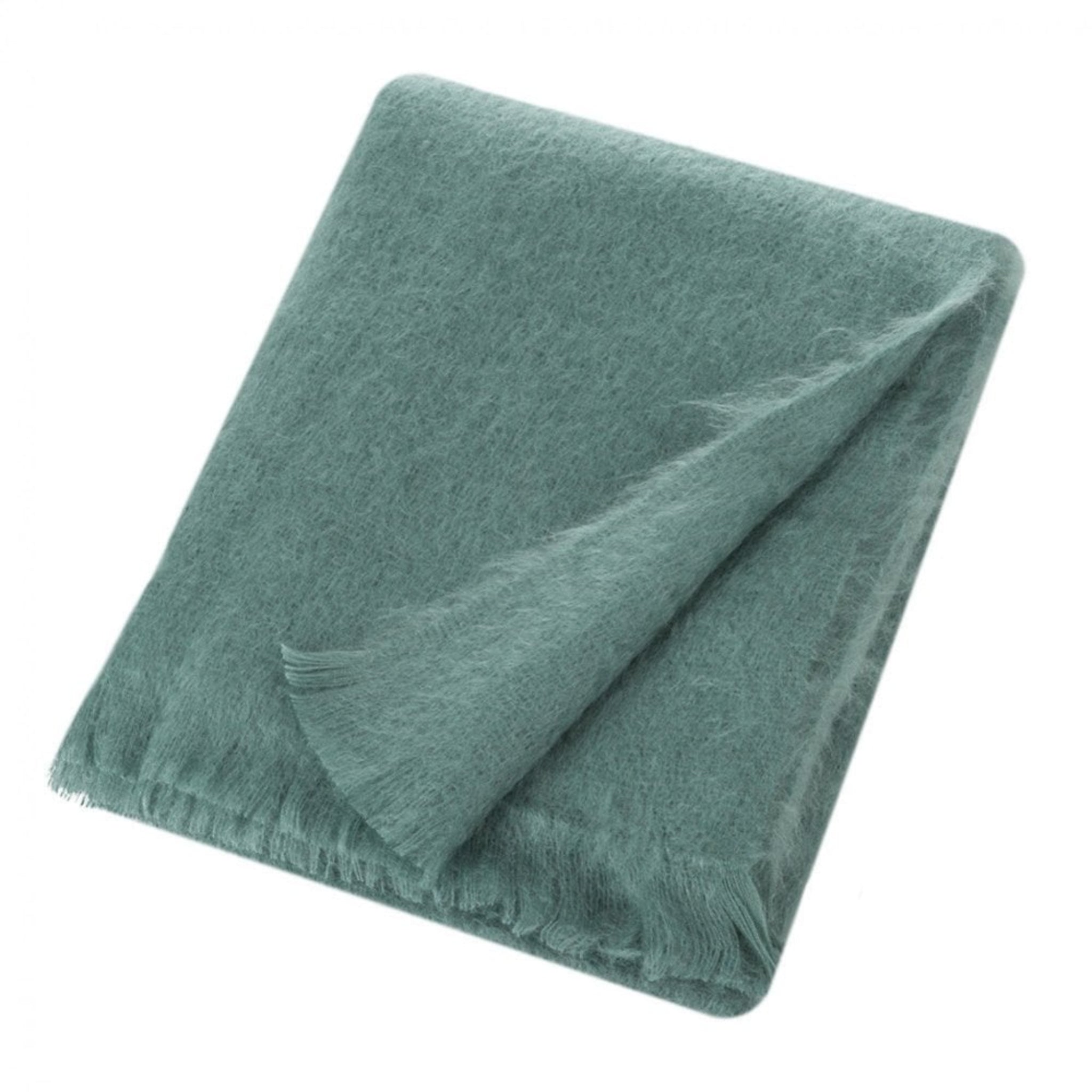 A folded dusty teal green blanket with fringed edges, shown on a solid white background.