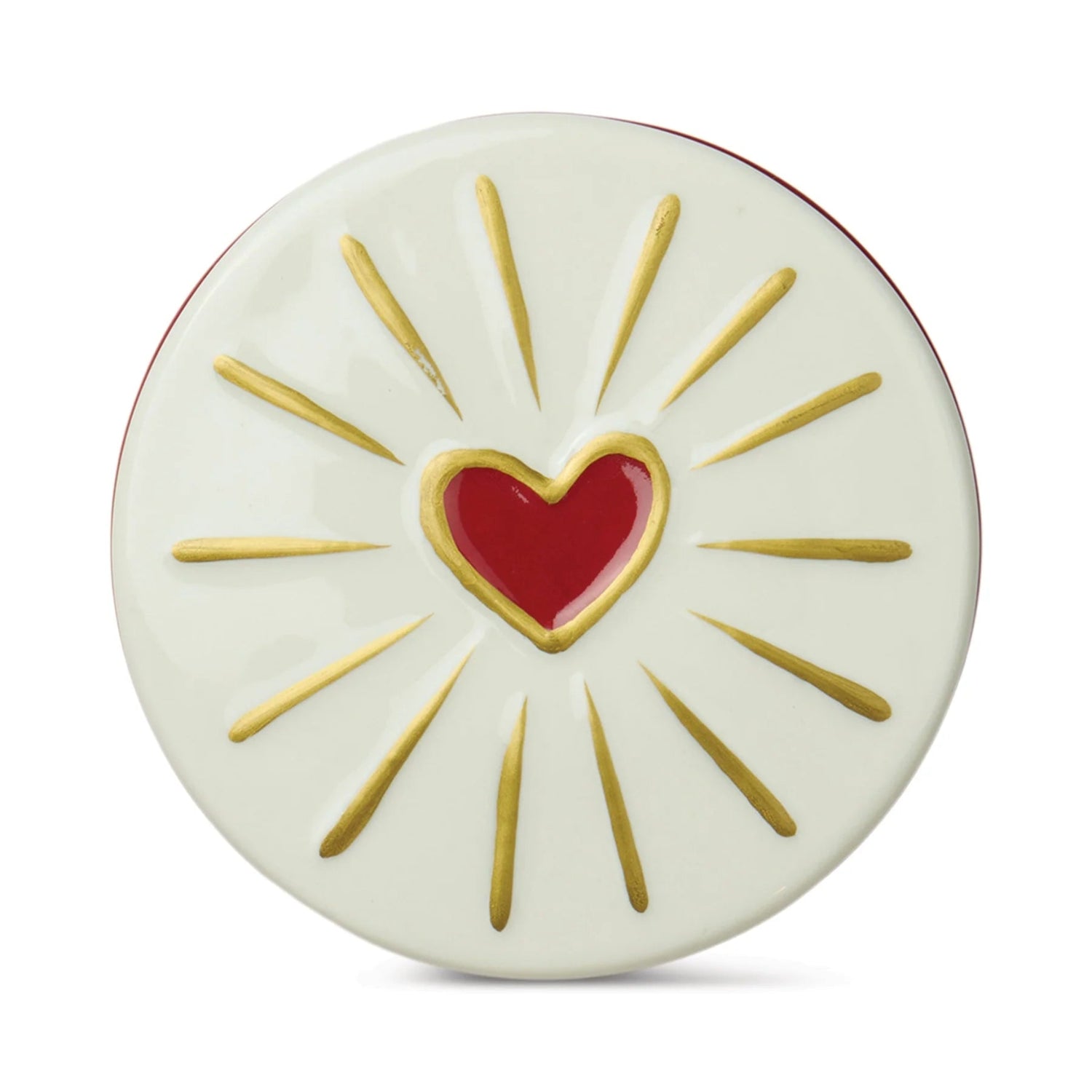 Decorative plate with a red heart in the center and gold rays on a white background