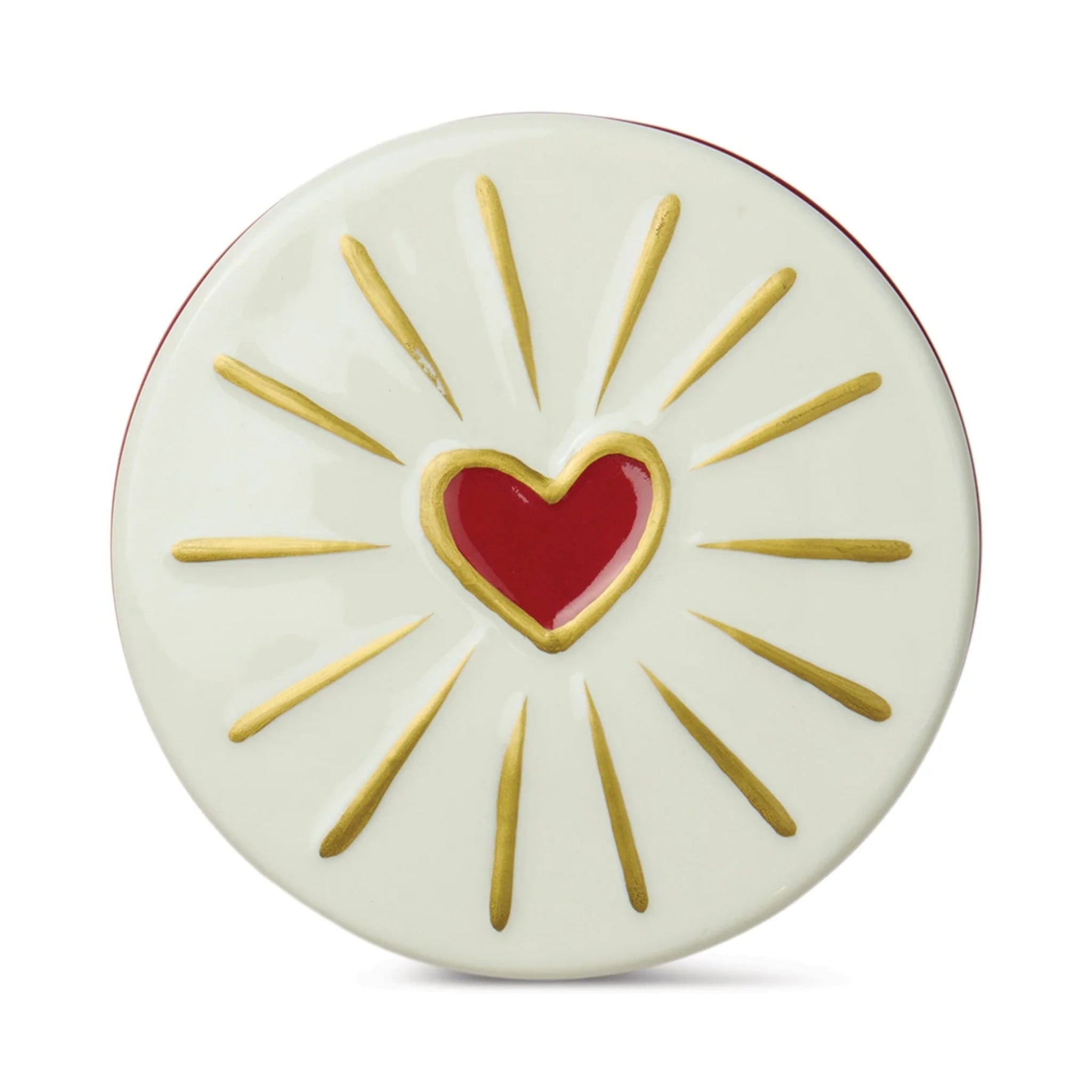 Decorative plate with a red heart in the center and gold rays on a white background