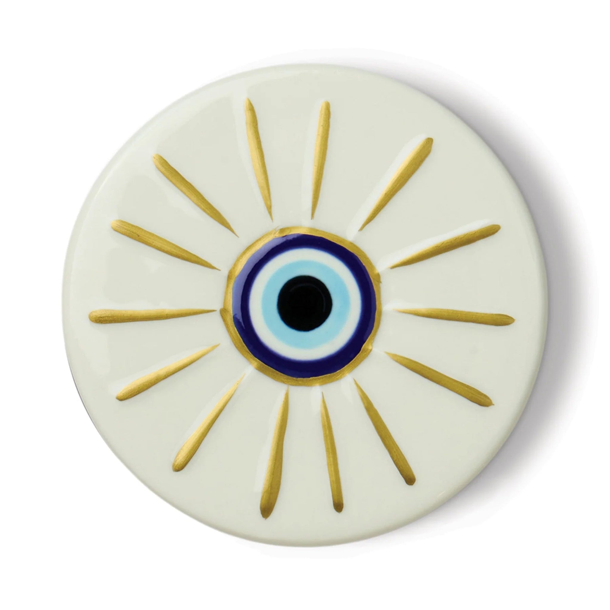 Round ceramic plate with an eye design featuring gold rays on a white background