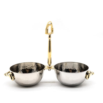 A pair of hammered silver bowls with gold-toned handles and side grips, displayed on a clean white background.