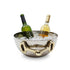 A hammered silver wine bucket filled with ice, holding two wine bottles, on a white background.