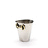 A small hammered silver metal cup with a gold horsebit handle, photographed on a clean white background.