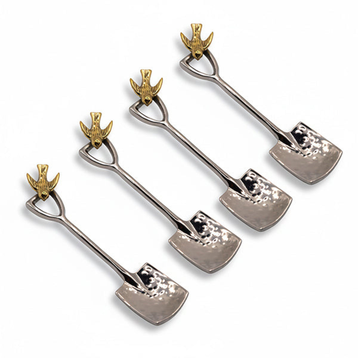 Four miniature shovel-shaped metal ornaments arranged diagonally on a plain white background. Each shovel has a hammered silver-toned blade and a polished gold-toned bird-shaped handle loop.
