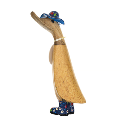 Wooden duck figurine with a hat and boots on a white background