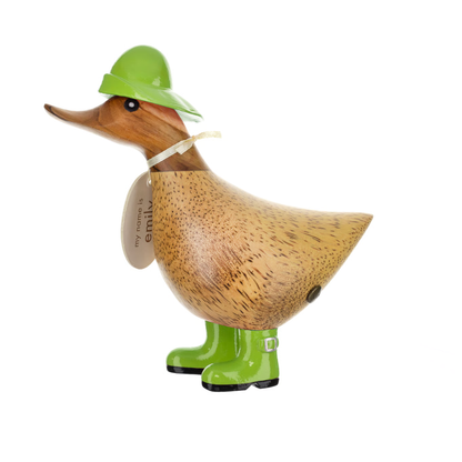 Wooden duck figurine wearing a green hat and boots on a white background