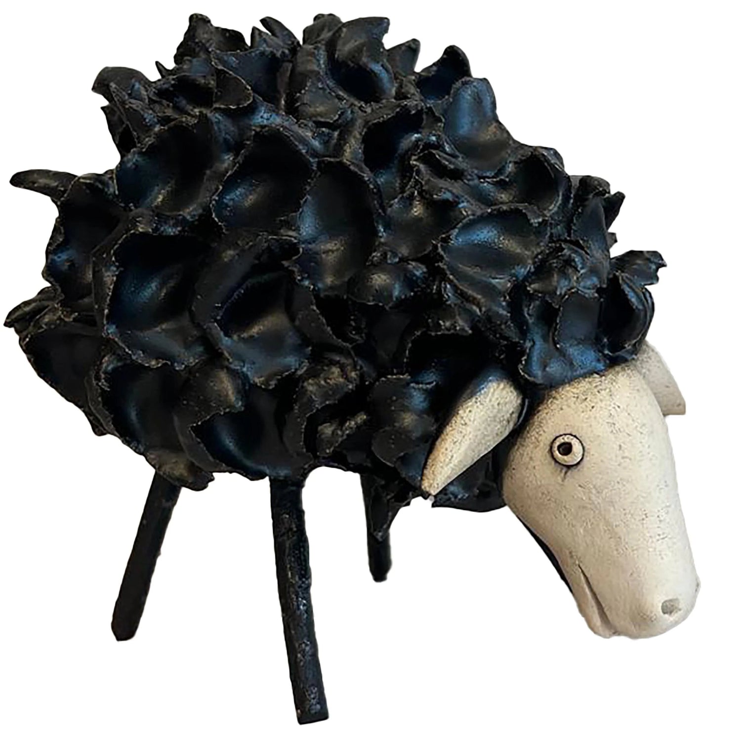 Decorative black sheep figurine with a white face on a white background