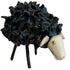 Decorative black sheep figurine with a white face on a white background