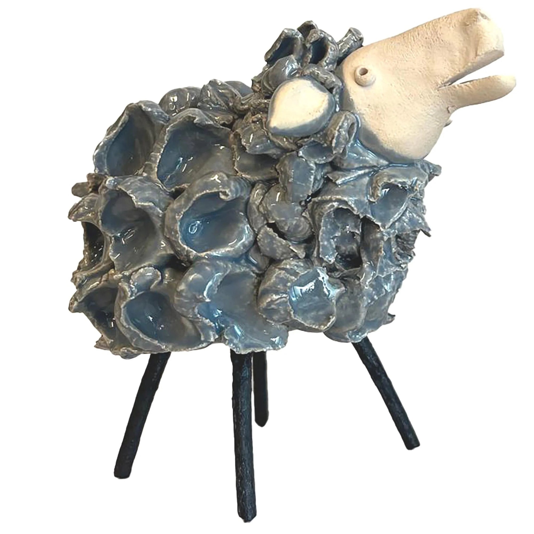 Decorative sculpture of a sheep with a textured wooly body on a white background
