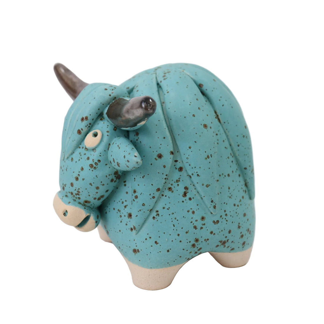 Blue ceramic bull figurine on a white background