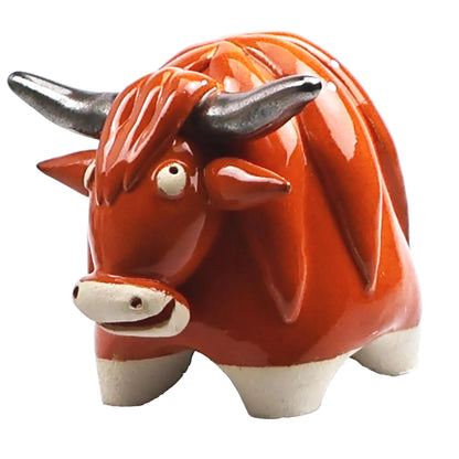  ceramic bull figurine on a white background