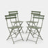 Set of four green folding chairs on a white background