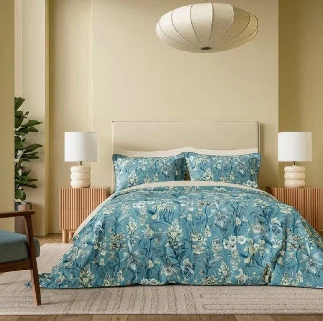 Bedroom with floral bedding, headboard, and lamps on a neutral color scheme.